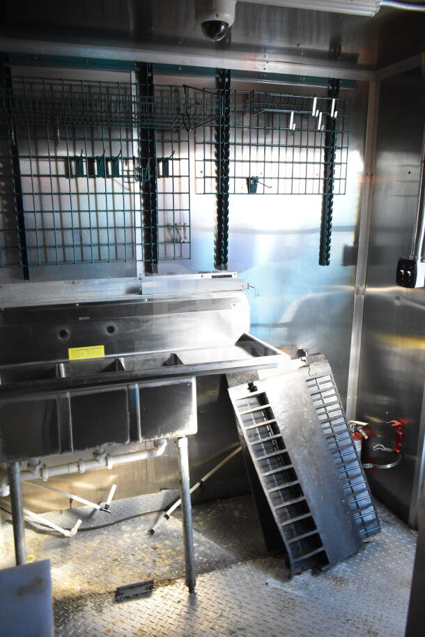 2021 Diamond Cargo 8.5'x24' food trailer interior, featuring stainless steel sink and shelving. Includes fryer, grease hood, and suppression system.