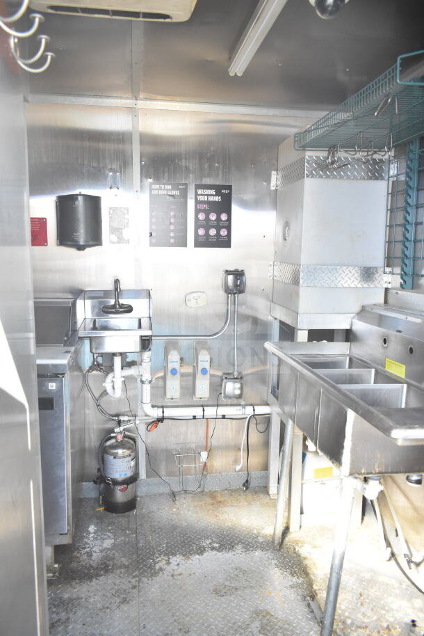 2021 Diamond Cargo 8.5'x24' food trailer interior featuring a grease hood, suppression system, and Frymaster gas fryer.