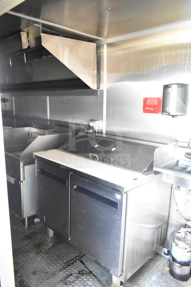 2021 Diamond Cargo 8.5'x24' food trailer interior with grease hood, suppression system, refrigeration, Frymaster gas fryer.