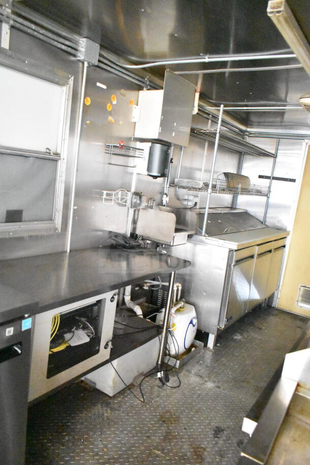 2021 Diamond Cargo 8.5'x24' food trailer interior with grease hood, suppression system, refrigeration, and Frymaster gas fryer.