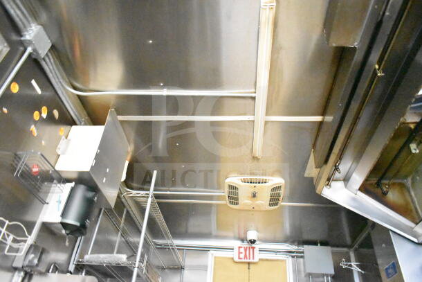 2021 Diamond Cargo 8.5'x24' food trailer interior, featuring stainless steel walls, grease hood, and ventilation system.