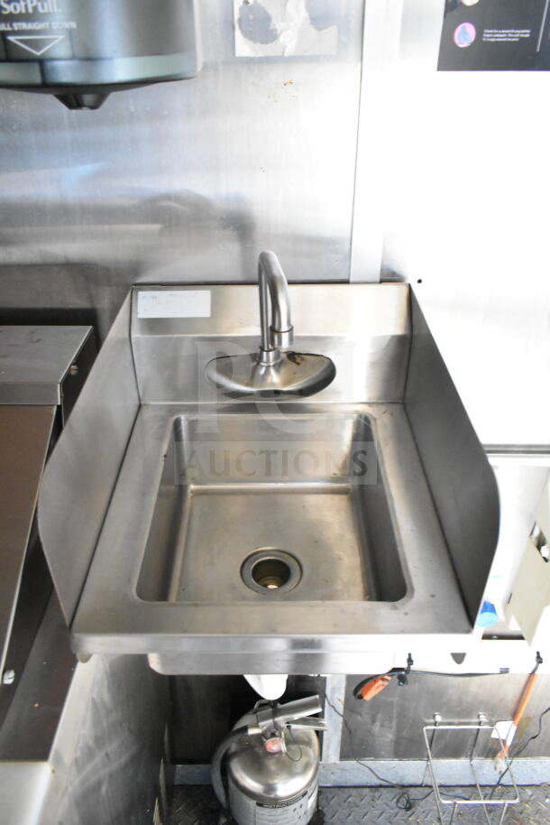 2021 Diamond Cargo food trailer sink area with stainless steel basin and faucet. Visible fire extinguisher below.