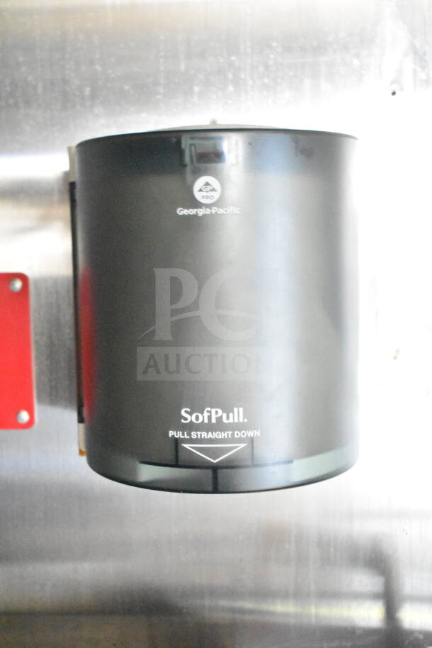 Georgia-Pacific SofPull paper towel dispenser mounted on a stainless steel surface.