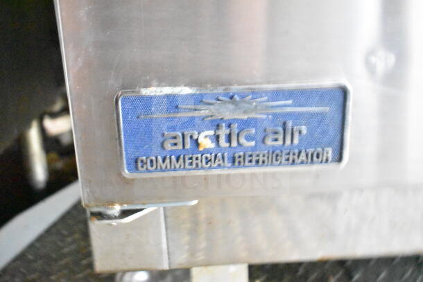 Alt text: Arctic Air Commercial Refrigerator label on 2021 Diamond Cargo food trailer, indicating included refrigeration equipment.