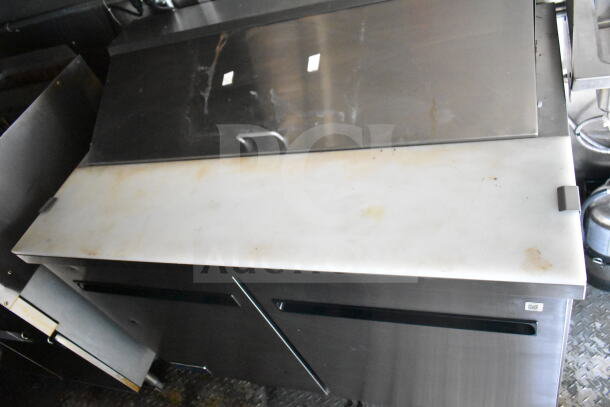 Diamond Cargo 8.5'x24' food trailer interior showing stainless steel prep counter, slight wear visible, 2021 model.