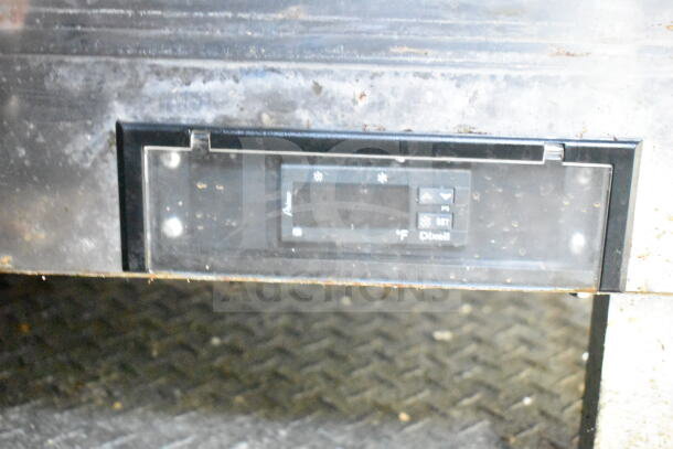 Close-up of refrigeration control panel in a 2021 Diamond Cargo food trailer. Shows temperature settings and controls.