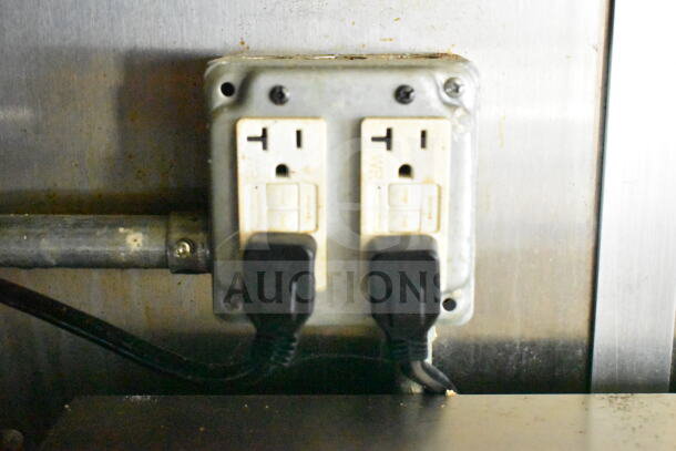 Electrical outlet in a 2021 Diamond Cargo 8.5'x24' food trailer, connected to appliances, showcasing wiring and functionality.
