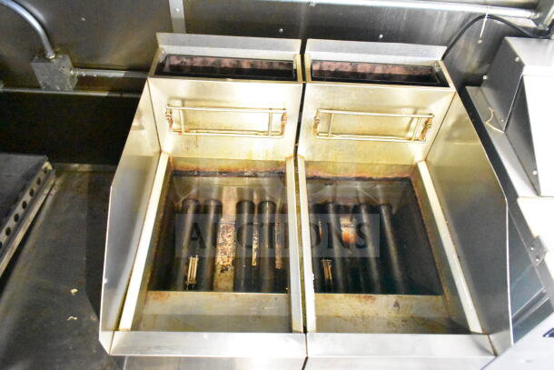 Dual Frymaster gas fryers in a 2021 Diamond Cargo food trailer, showing stainless steel construction and used condition.