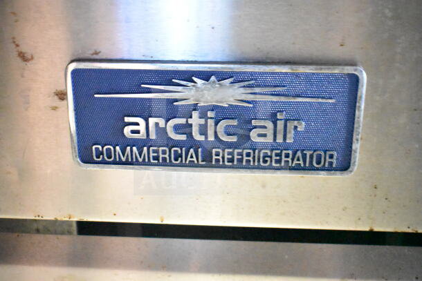 "Arctic Air commercial refrigerator label on 2021 Diamond Cargo food trailer with grease hood, suppression system, and Frymaster fryer."