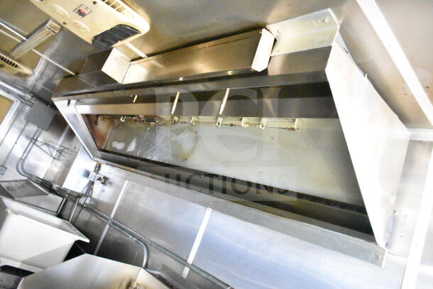 2021 Diamond Cargo 8.5'x24' food trailer interior with grease hood and suppression system in good condition.