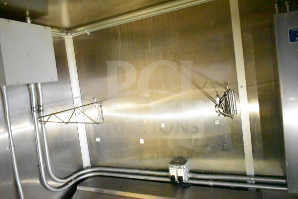 2021 Diamond Cargo 8.5'x24' food trailer interior with grease hood, suppression system, electrical outlets, and utility connections.