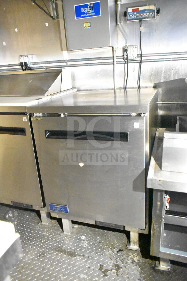 2021 Diamond Cargo 8.5'x24' food trailer interior with stainless steel freezer, refrigeration, and Pyro-Chem system.