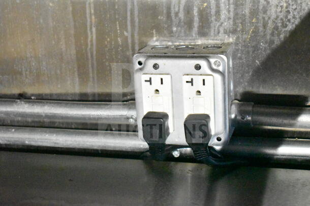 2021 Diamond Cargo food trailer outlet with dual plugs and cords. Part of electrical system, indicating kitchen utility.
