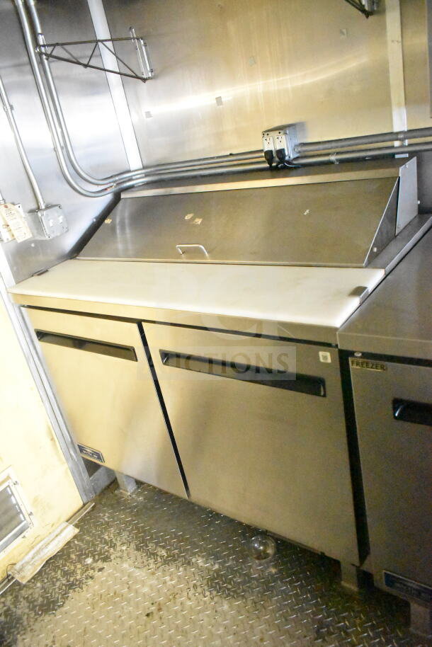2021 Diamond Cargo 8.5'x24' food trailer interior, featuring refrigeration unit, stainless steel, and Frymaster gas fryer.