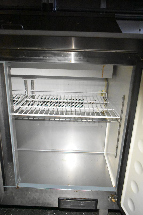 2021 Diamond Cargo food trailer refrigeration; empty interior, metal shelving, clean condition, part of VIN: 53NBE242XM1089713.