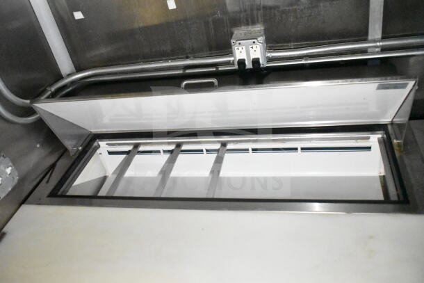 2021 Diamond Cargo 8.5'x24' food trailer interior showing refrigeration unit, stainless steel, with overhead electrical wiring.