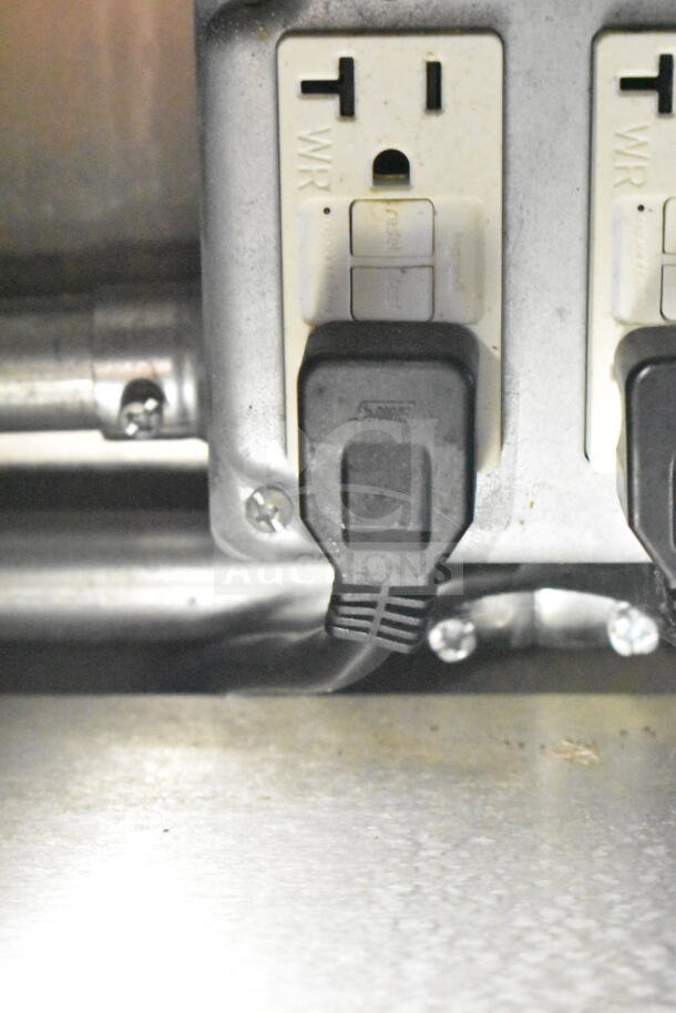 Outlet in 2021 Diamond Cargo food trailer. Shows electrical plug connections, highlighting power setup condition.