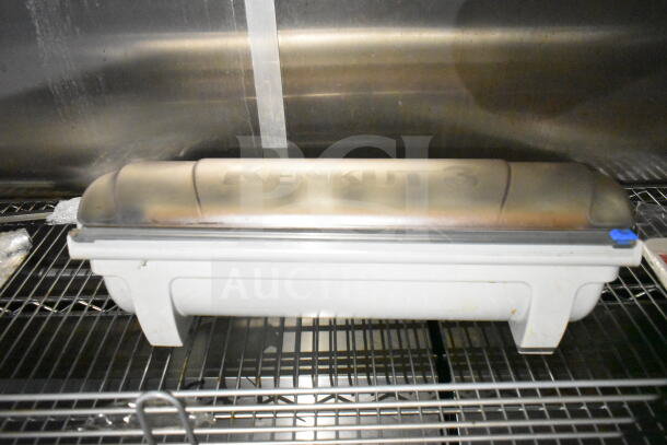 2021 Diamond Cargo 8.5'x24' food trailer interior with Kenkut 3 dispenser on shelf, part of stainless steel kitchen setup.