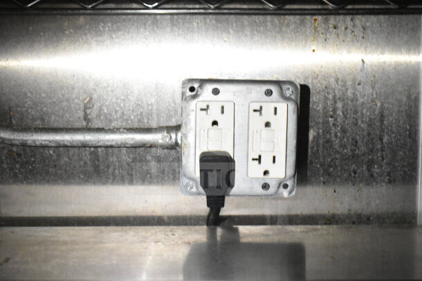 Electrical outlet inside 2021 Diamond Cargo food trailer, indicating available plug-in power.