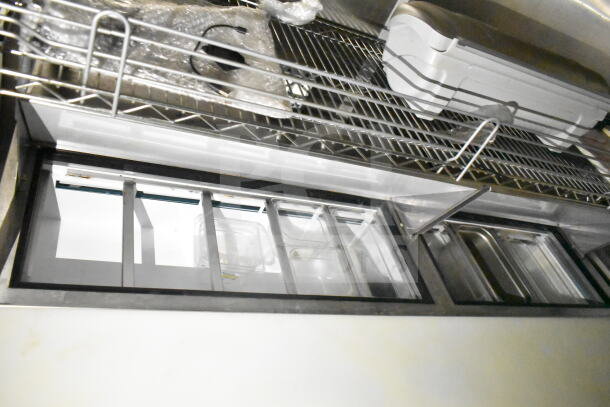 2021 Diamond Cargo 8.5'x24' food trailer interior, featuring refrigeration units, shelving, and compartments.