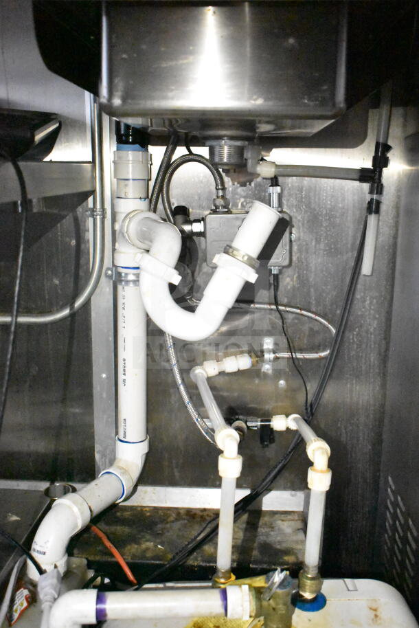 2021 Diamond Cargo food trailer interior showing plumbing pipes and fittings. Clean, functional condition.