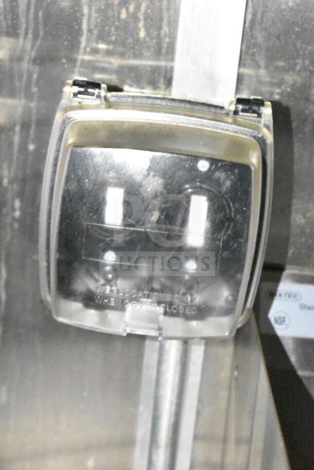 Close-up of wall-mounted electrical box inside a 2021 Diamond Cargo food trailer. Text on box: "WET LOCATIONS ONLY."