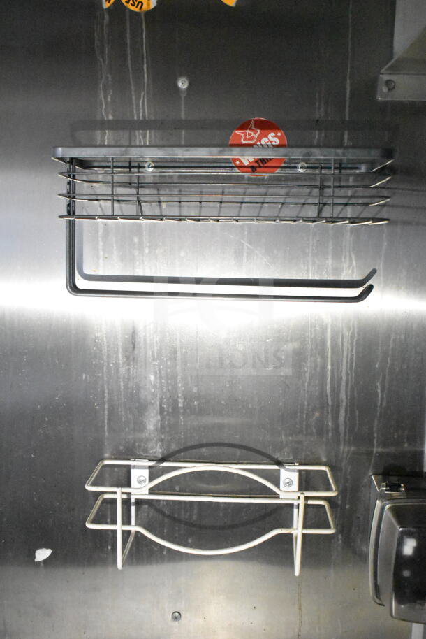 Metal interior racks inside 2021 Diamond Cargo food trailer. Shows mounting screws and metal structure.