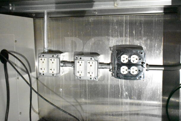 Electrical outlets inside a 2021 Diamond Cargo food trailer. Industrial setup includes multiple sockets on a metal surface.