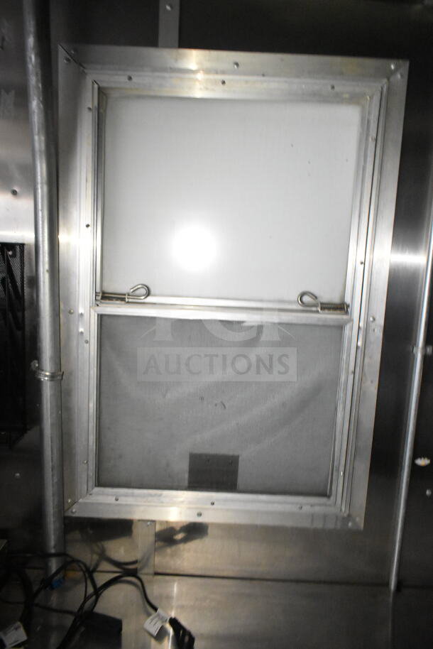 2021 Diamond Cargo food trailer interior with stainless steel vent, grease hood, and visible wiring, showcasing industrial durability.