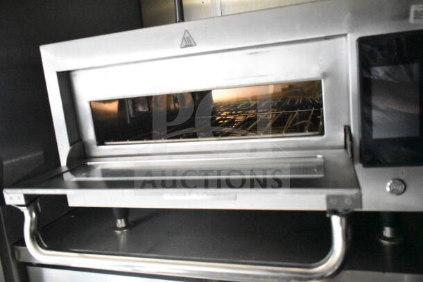 2021 Diamond Cargo food trailer interior, featuring stainless steel oven, grease hood, and Frymaster gas fryer.