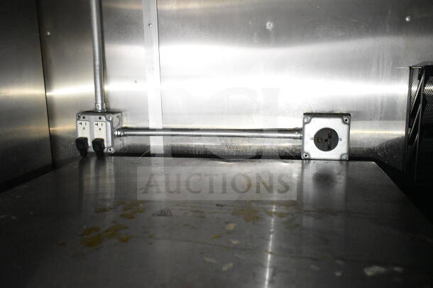 Interior of 2021 Diamond Cargo 8.5'x24' food trailer showing electrical outlets and stainless steel surfaces.