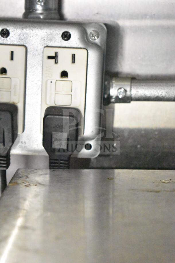 Outlet in Diamond Cargo 2021 food trailer, showing power connections, indicative of electrical integration for appliances.