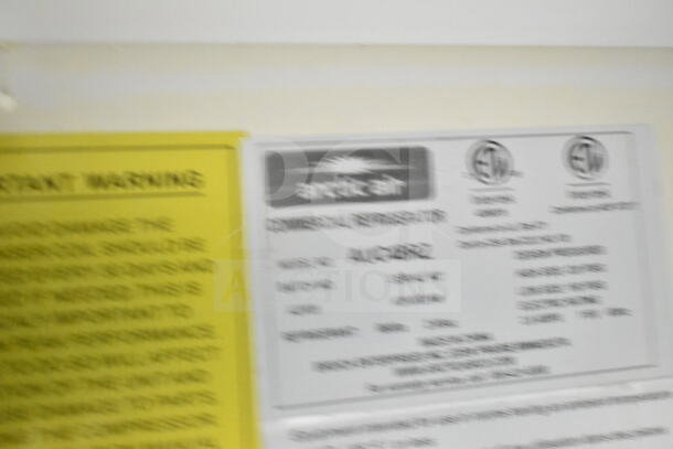 2021 Diamond Cargo food trailer tag showing model AUC48R2, specifying refrigeration details.