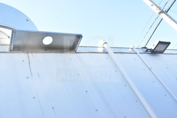 Exterior detail of a 2021 Diamond Cargo 8.5'x24' food trailer showing roof vent and piping.