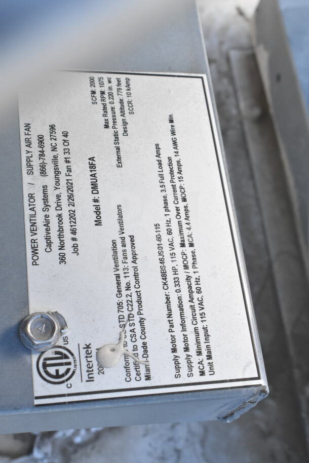 Label on food trailer's power ventilator showing model DMUA18FA and specs, by CaptiveAire Systems, Youngsville, NC.