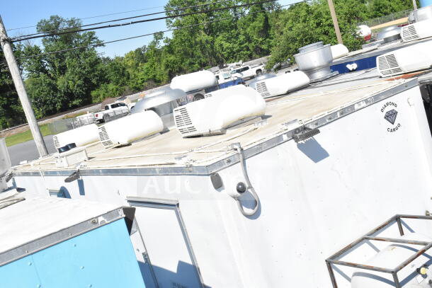 2021 Diamond Cargo 8.5'x24' food trailer, grease hood, suppression system, and Frymaster gas fryer. Clean, visible branding.