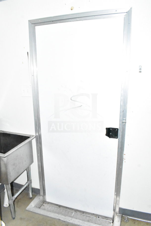 2021 Diamond Cargo 8.5'x24' food trailer interior showing stainless steel sink and utility door.