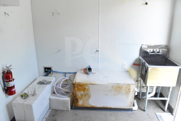 2021 Diamond Cargo 8.5'x24' food trailer interior with sink, fire extinguisher, and utility hookups. Used condition.