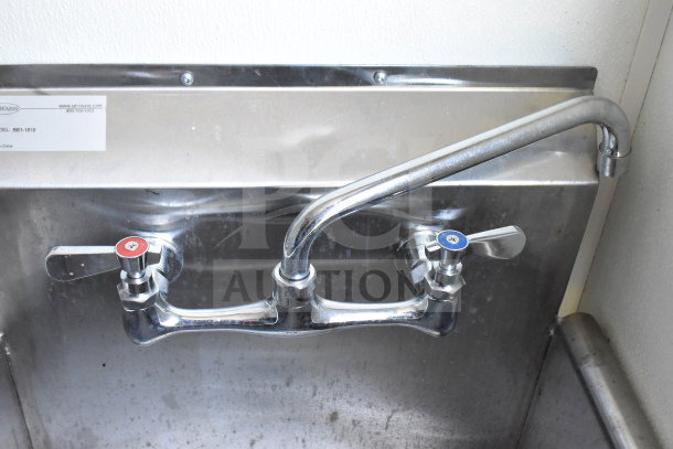 Stainless steel sink with dual faucets in a Diamond Cargo food trailer, model BSI-1818.
