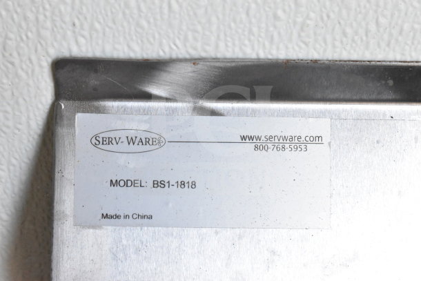 Close-up of Serv-Ware label on 2021 Diamond Cargo 8.5'x24' food trailer, indicating model BS1-1818, made in China.