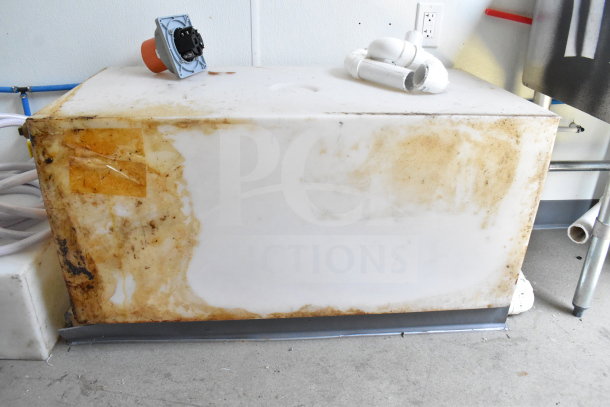 2021 Diamond Cargo 8.5'x24' food trailer with visible discoloration and plumbing components. VIN: 53NBE2424M1089867.