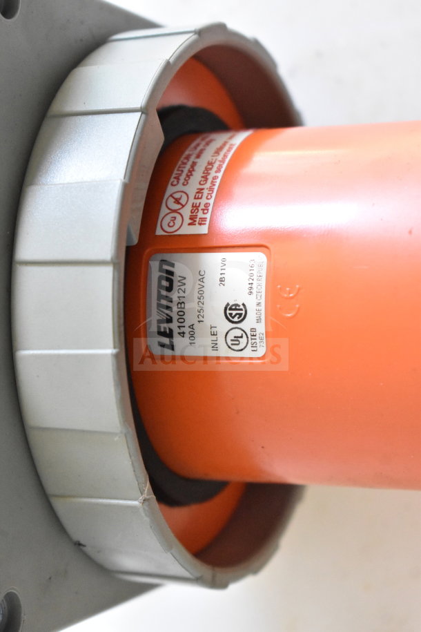 Orange power inlet of a 2021 Diamond Cargo food trailer, labeled "Leviton 4100B12W, 100A, 125/250VAC."