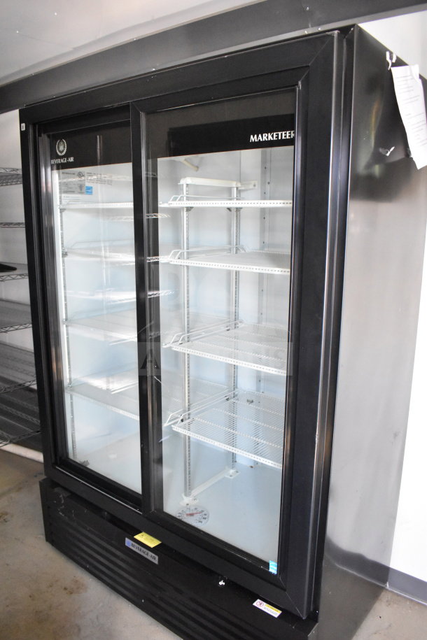Black Beverage-Air Marketeer commercial display fridge with glass doors, inside 2021 Diamond Cargo 8.5'x24' food trailer.