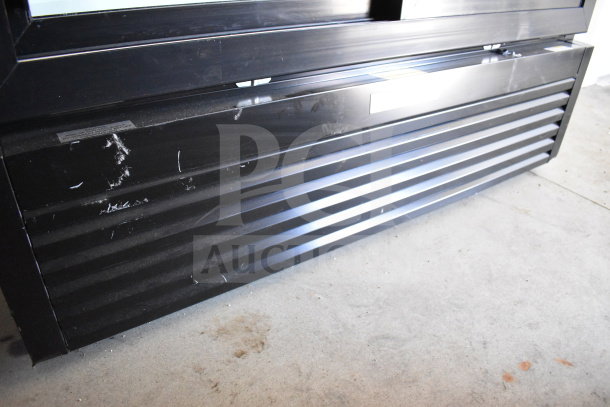 2021 Diamond Cargo 8.5'x24' trailer base detail, featuring black exterior with slight wear. VIN: 53NBE2424M1089867.