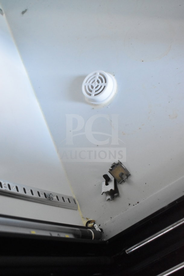 Interior view of 2021 Diamond Cargo 8.5'x24' cold food trailer, showing ventilation and metal fixtures. Clean white finish.