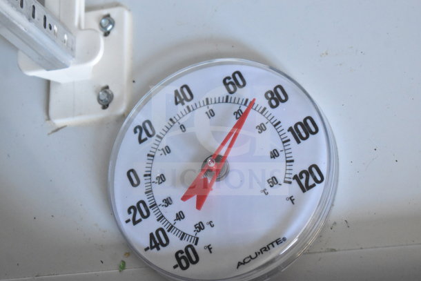 AcuRite thermometer inside 2021 Diamond Cargo 8.5'x24' trailer, showing current temperature around 70°F.