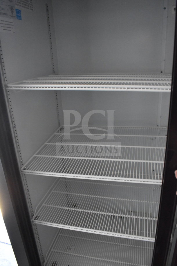 Interior of a 2021 Diamond Cargo cold food/beverage trailer showing empty white wire shelves.