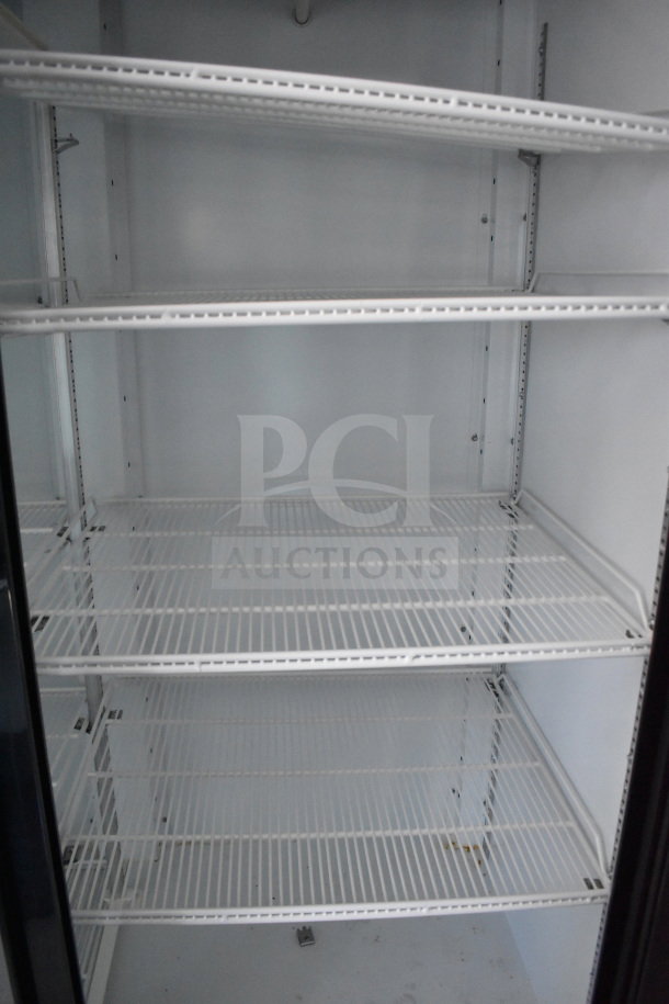 Interior view of a 2021 Diamond Cargo 8.5'x24' cold food/beverage trailer showing clean white wire shelving.