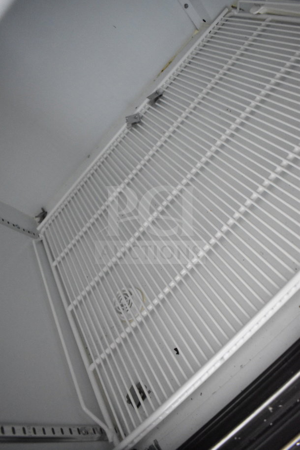 2021 Diamond Cargo 8.5'x24' trailer interior showing cooling racks, VIN: 53NBE2424M1089867. Perfect for cold storage.