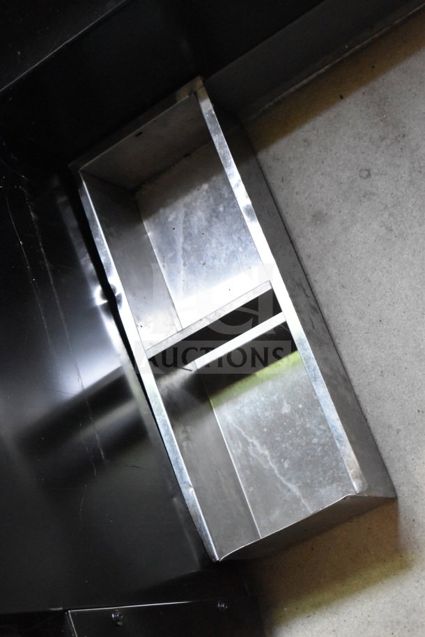 Metallic interior shelf for a 2021 Diamond Cargo 8.5'x24' trailer, showing sturdy construction and clean condition.